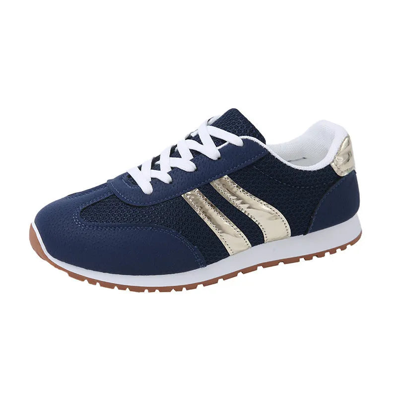 Blue women's casual tennis shoes with cross shoulder straps and a lace-up front on a rubber sole.