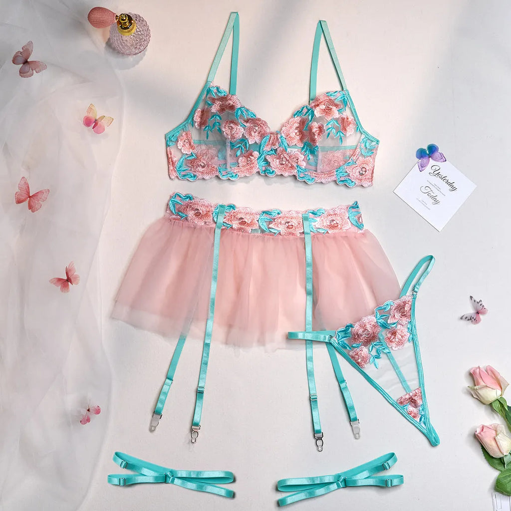 Pink women's mesh pettiskirt costume suit with matching bikini on a mannequin.