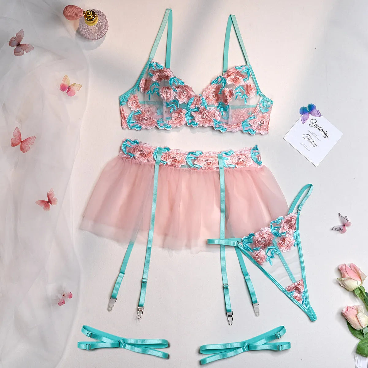 Pink women's mesh pettiskirt costume suit with matching bikini on a mannequin.