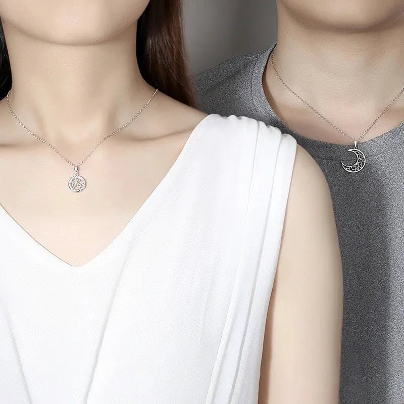 Copper sun and moon couple necklace with electroplated finish on a cross chain.