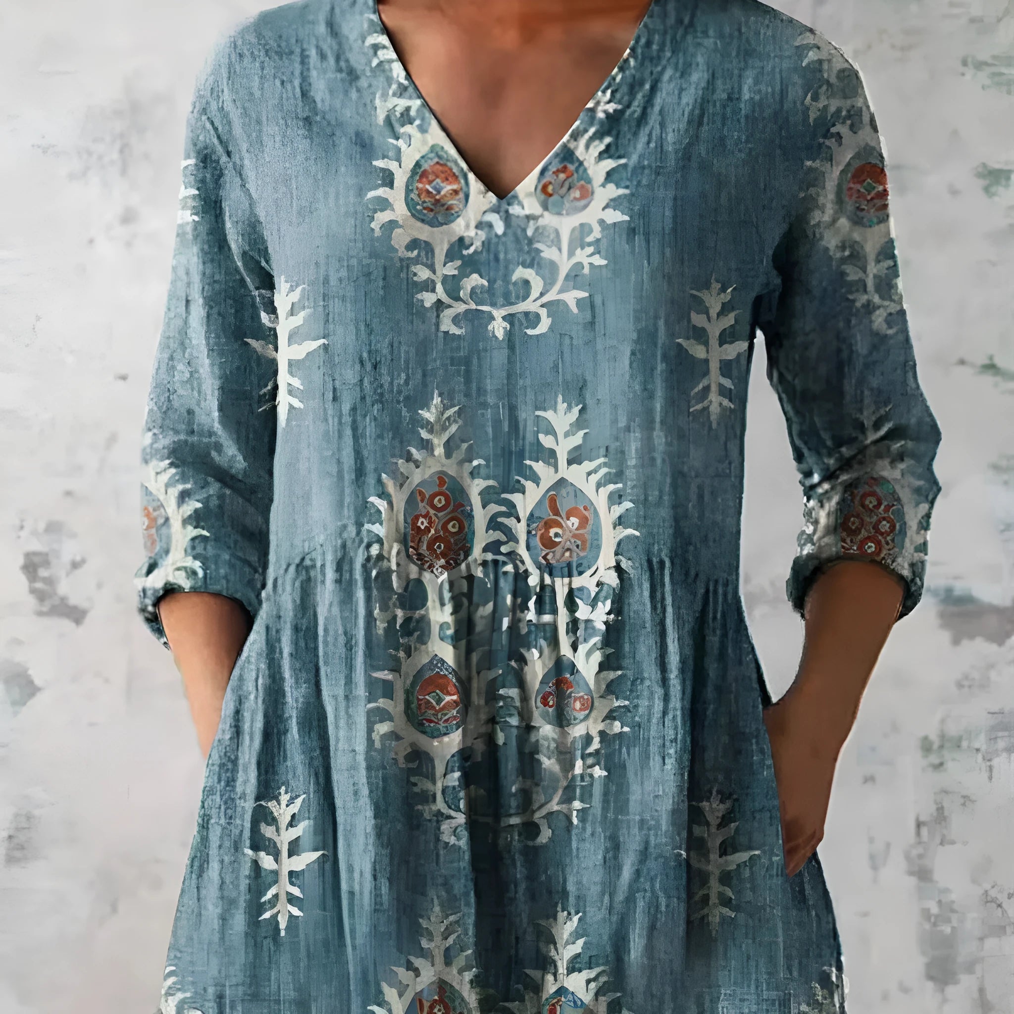Women's loose floral print dress with wide waist and 3/4 length wave-pattern sleeves.