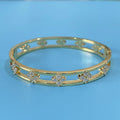 Hollow women's bracelet with four-leaf clover charm and zircon detail in gold or silver finish