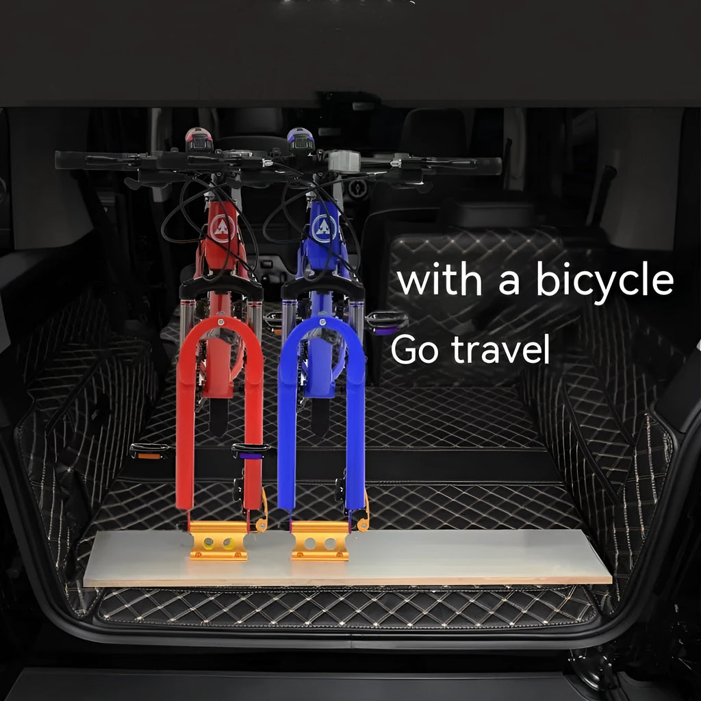 Silver metal quick-release clamp for securing a bicycle front fork during transport.