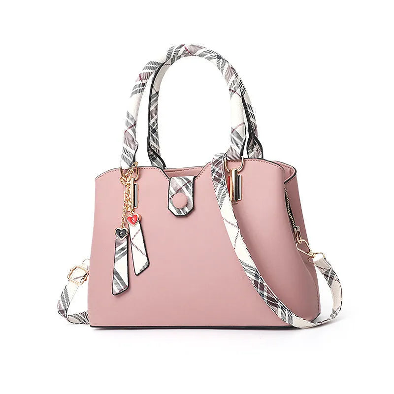 Ladies handbag in PU leather, medium Boston bag shape, square vertical section, with zipper closure and metal accents
