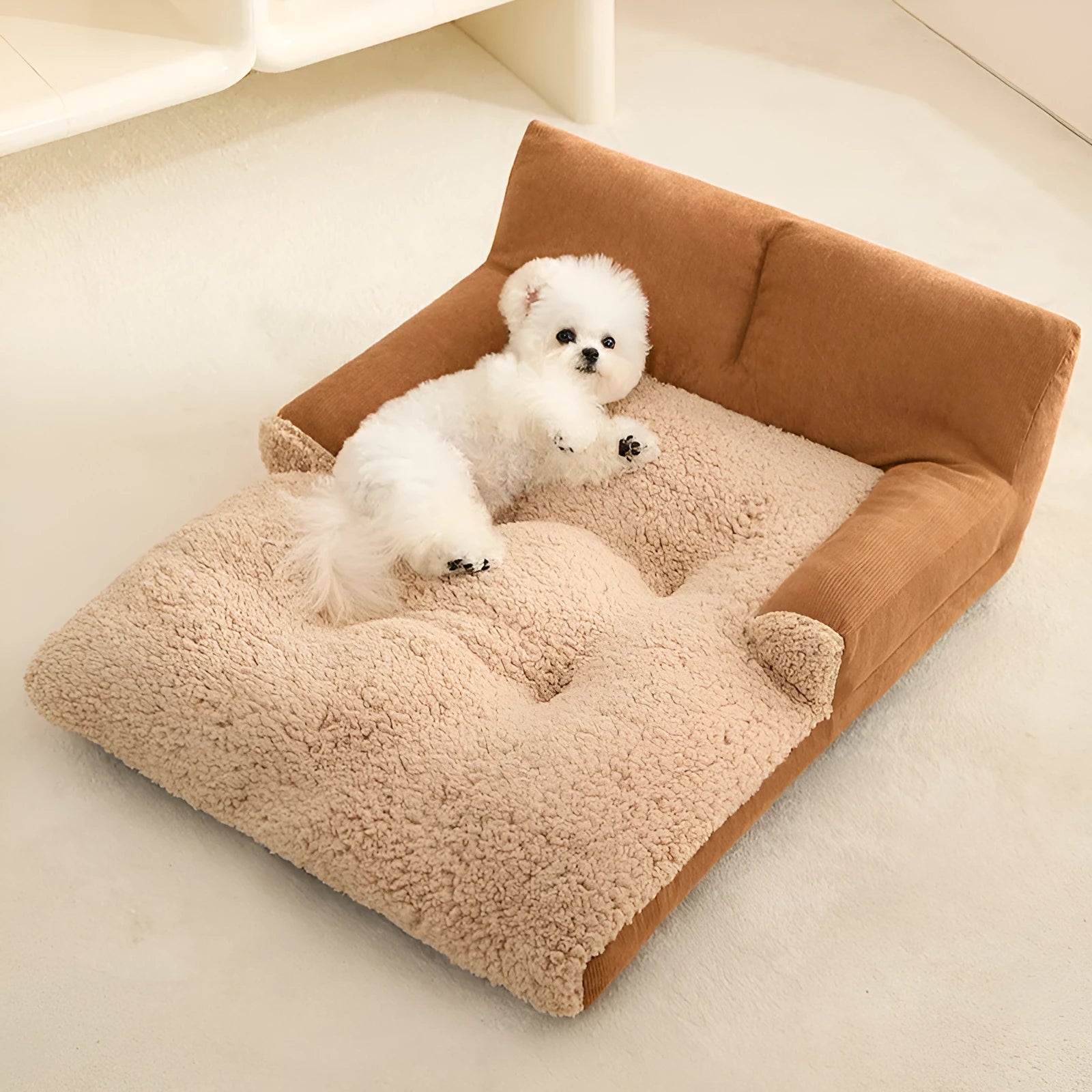 Small brown and grey fabric dog kennel bed with a plush cushion inside, showing its non-slip base.