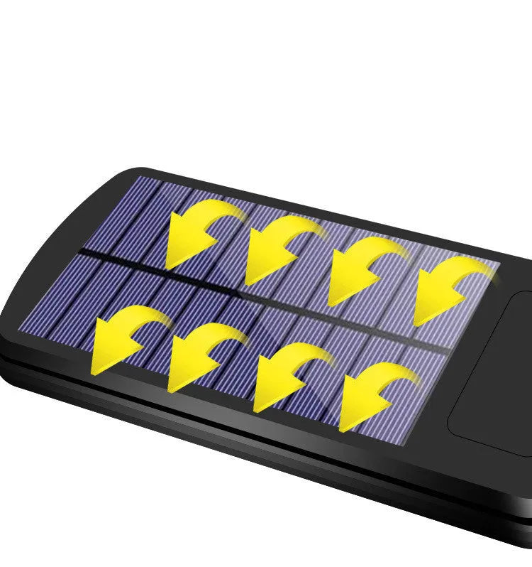 Black solar-powered outdoor motion sensor light mounted on a wall or fence post.