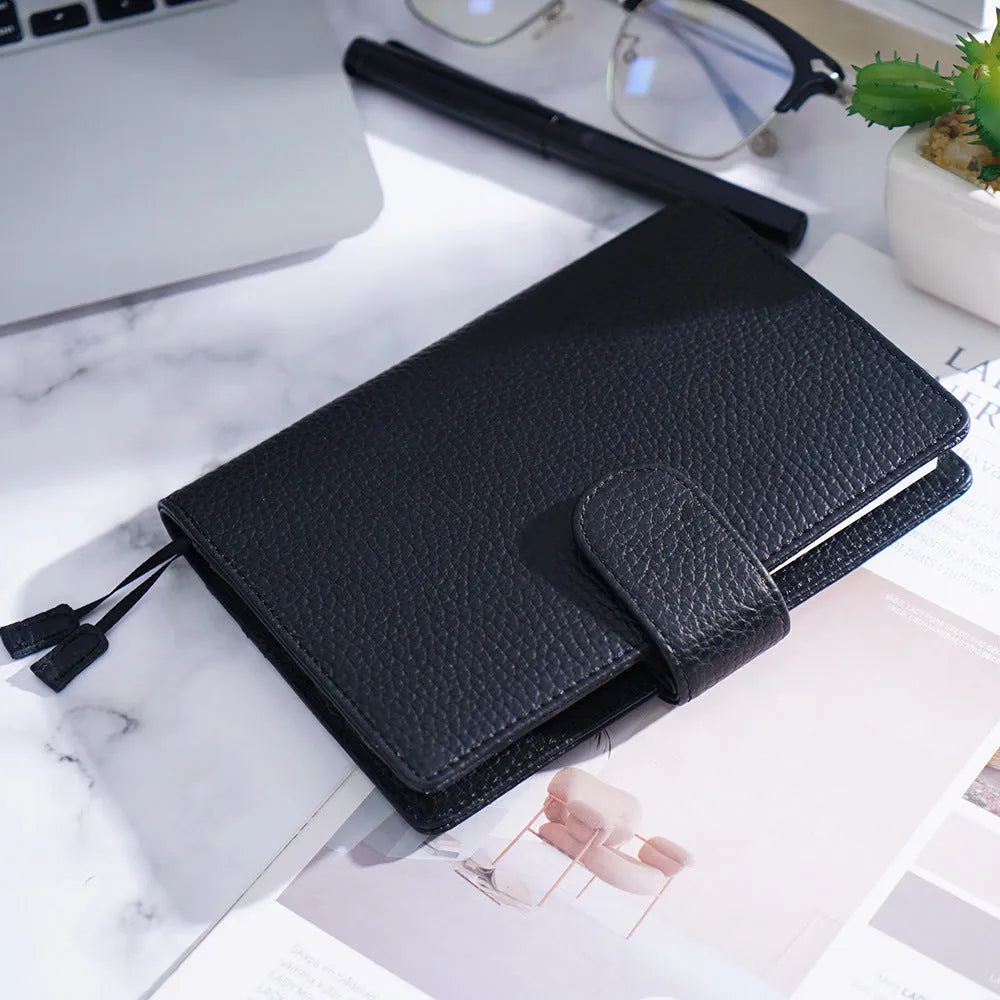 A6 size leather loose-leaf diary with a textured lychee pattern cowhide cover