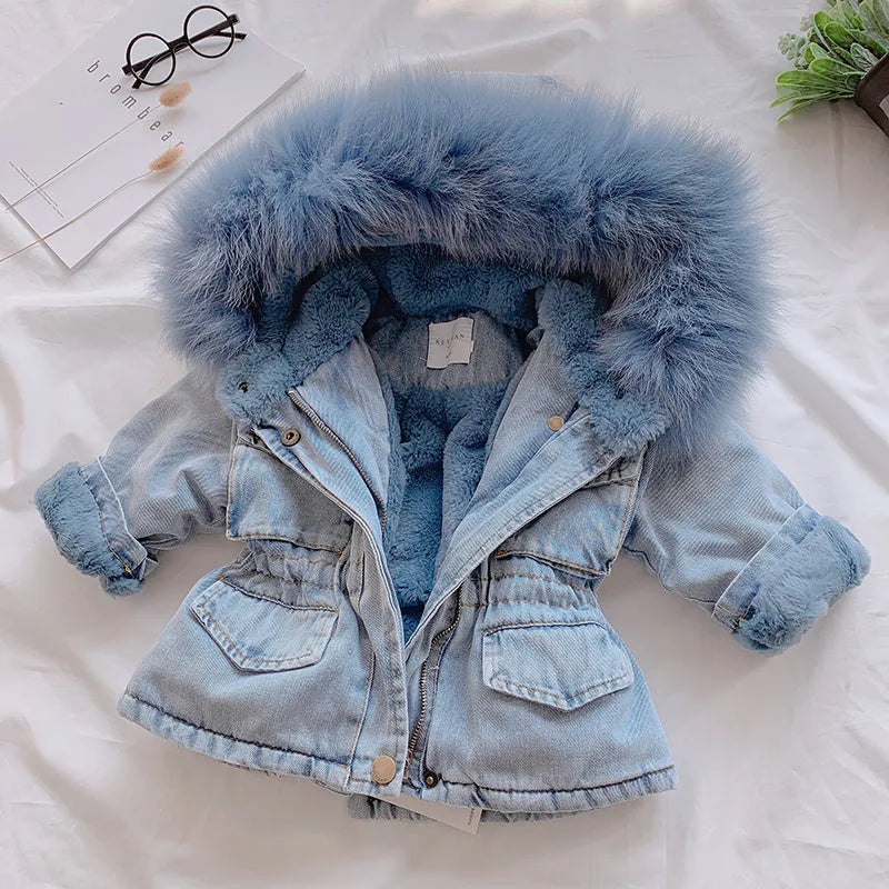 Blue denim coat for girls with a hood and plush fleece lining, shown on a hanger.