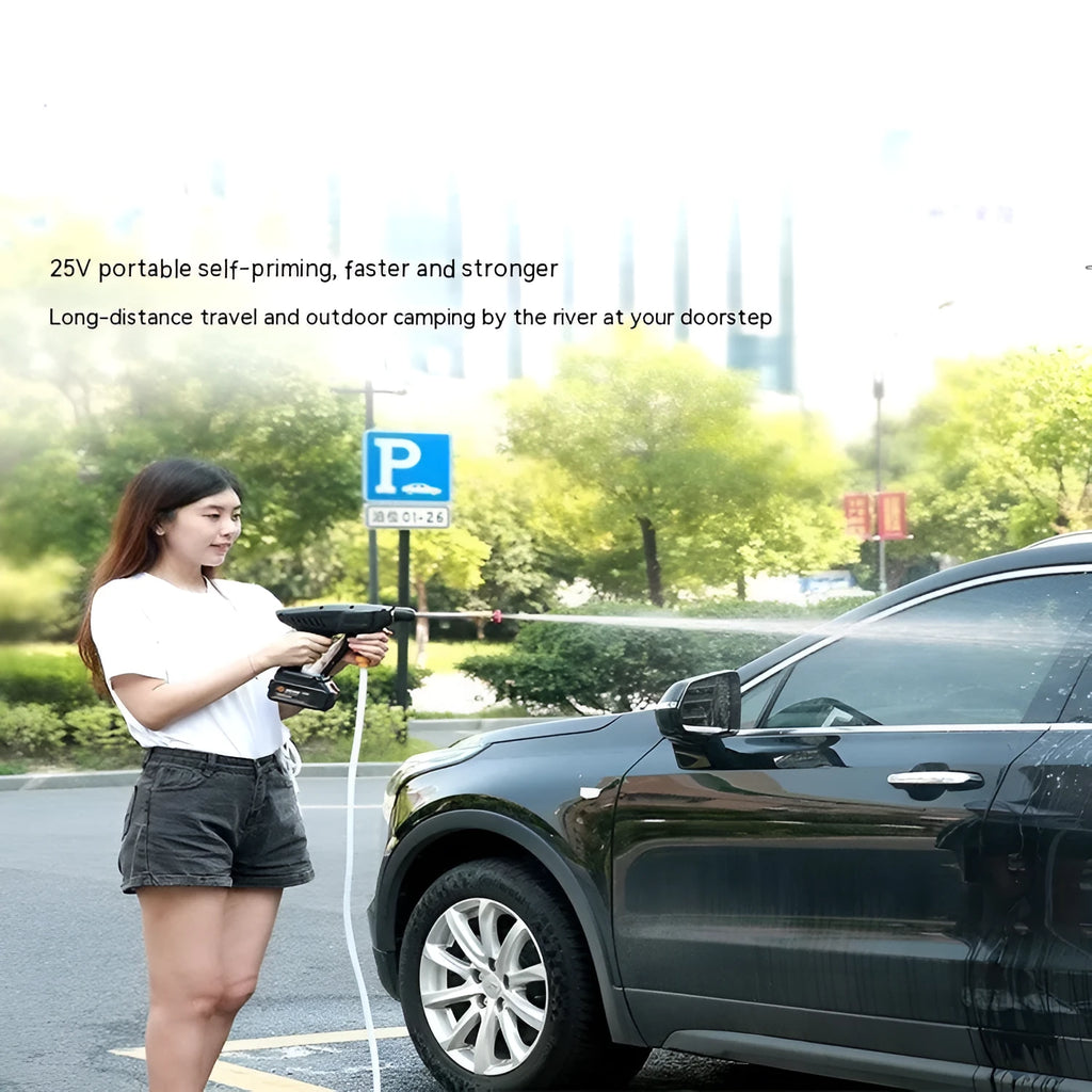 Wireless portable car washing machine with plastic gun and lithium battery on grass