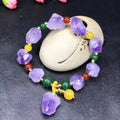 Natural style amethyst bead bracelet for women with a fu character charm.