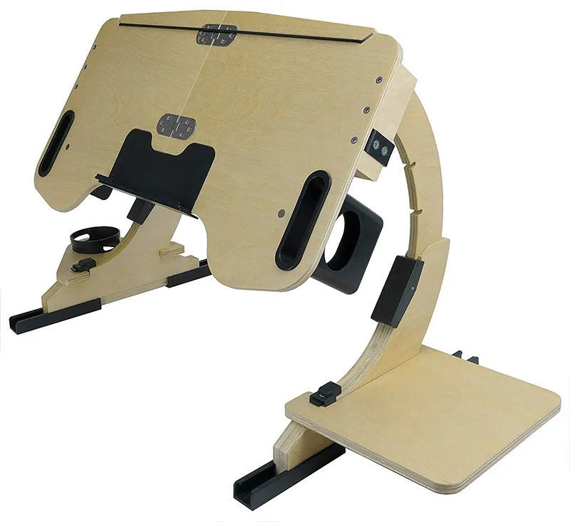 White wooden folding bed table with adjustable angle, holding a laptop.