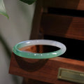 Solid chalcedony bracelet with misty rain pattern in blue-grey, shown in size No. 58.