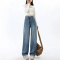 Retro blue high waist wide leg women's jeans on a hanger, showing straight leg cut.