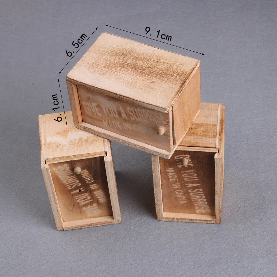 Wooden scare box prank toy with jumping animal surprise for April Fools gags