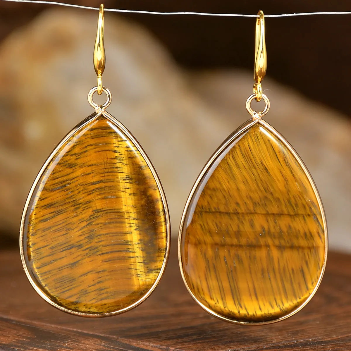 Women's retro-style drop earrings with a natural stone pendant in green aventurine on electroplated settings.