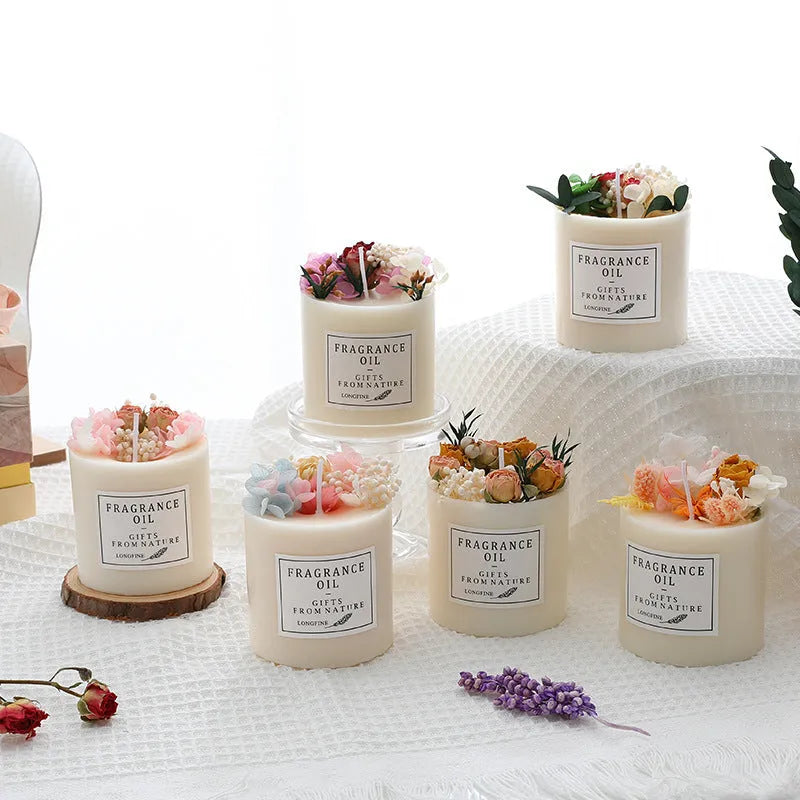 Scented aromatherapy candle with dried flower decoration on a wooden chip base.