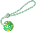 Dog toy featuring a natural rubber ball attached to a nylon rope for fetch and tug games.