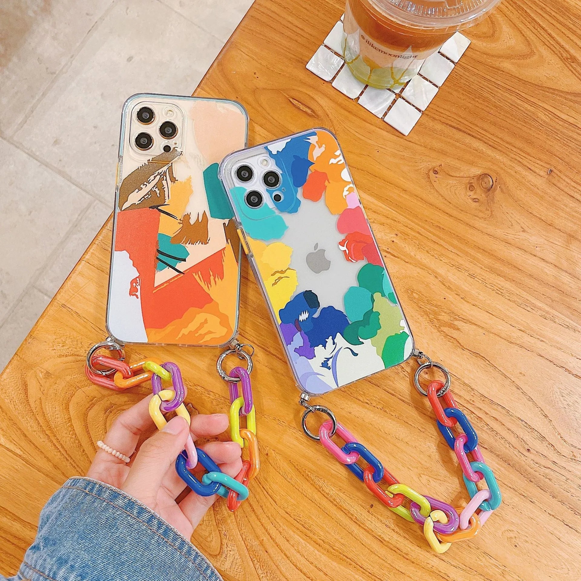 Personalised iPhone case with integrated wrist strap featuring graffiti design in TPU material