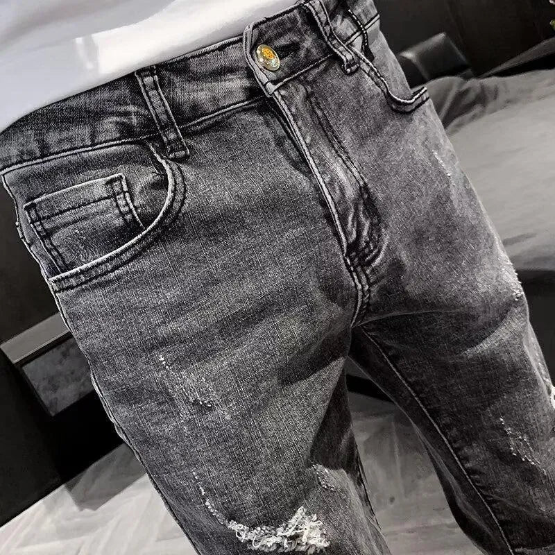 Men's high-waist blue denim jeans with button fly and standard trouser length on mannequin