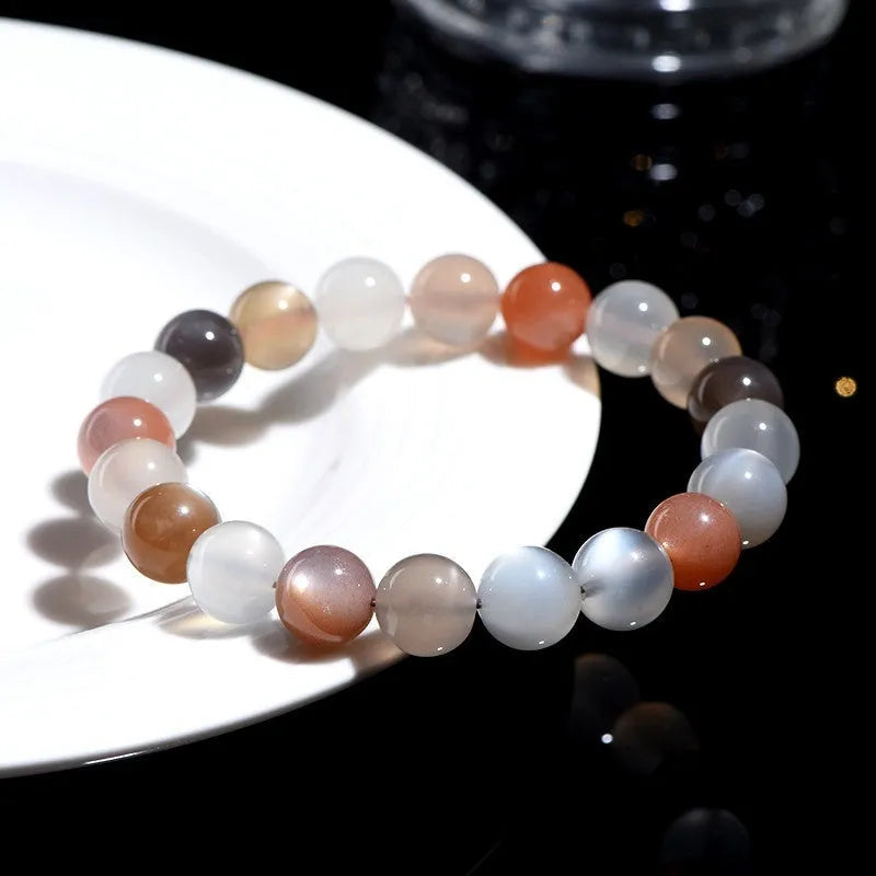 Natural colourful moonstone bracelet with a single 8mm bead on a cord.