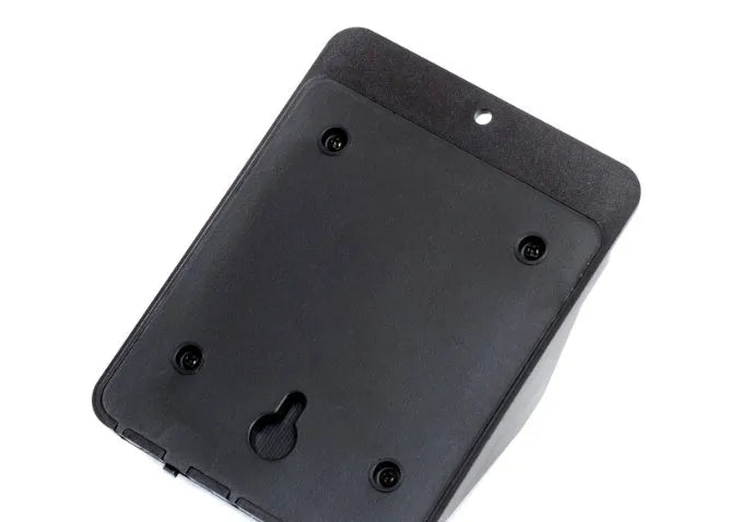 Grey solar-powered outdoor security light with four LED panels and a motion sensor mounted on a wall.