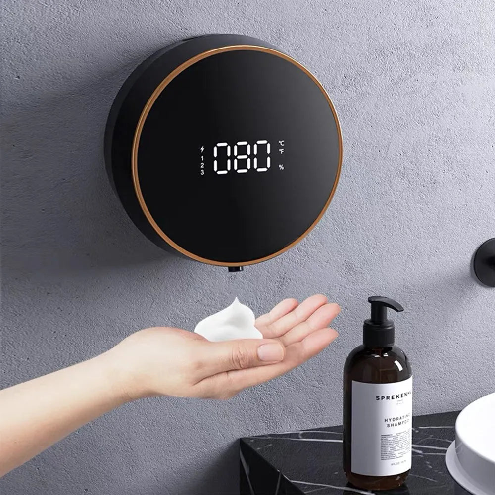 Black automatic touchless foam soap dispenser with USB charging port mounted on bathroom wall