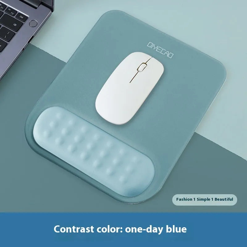 Ergonomic mouse pad with raised wrist support in a choice of contrast colour patterns on a desk.