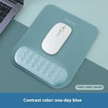Ergonomic mouse pad with raised wrist support in a choice of contrast colour patterns on a desk.