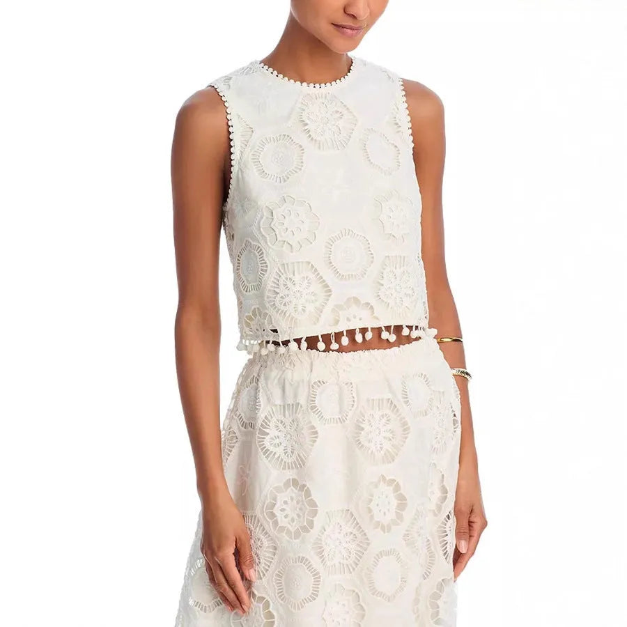 White women's retro co-ord suit with sleeveless top and embroidered long skirt