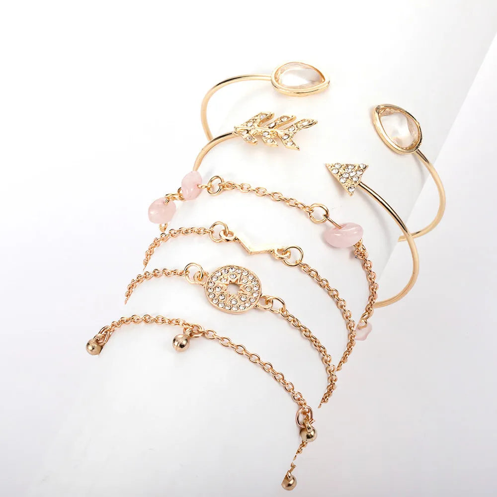 Gold-coloured zinc alloy women's bracelet set with six European-inspired designs including water drop and arrow shapes