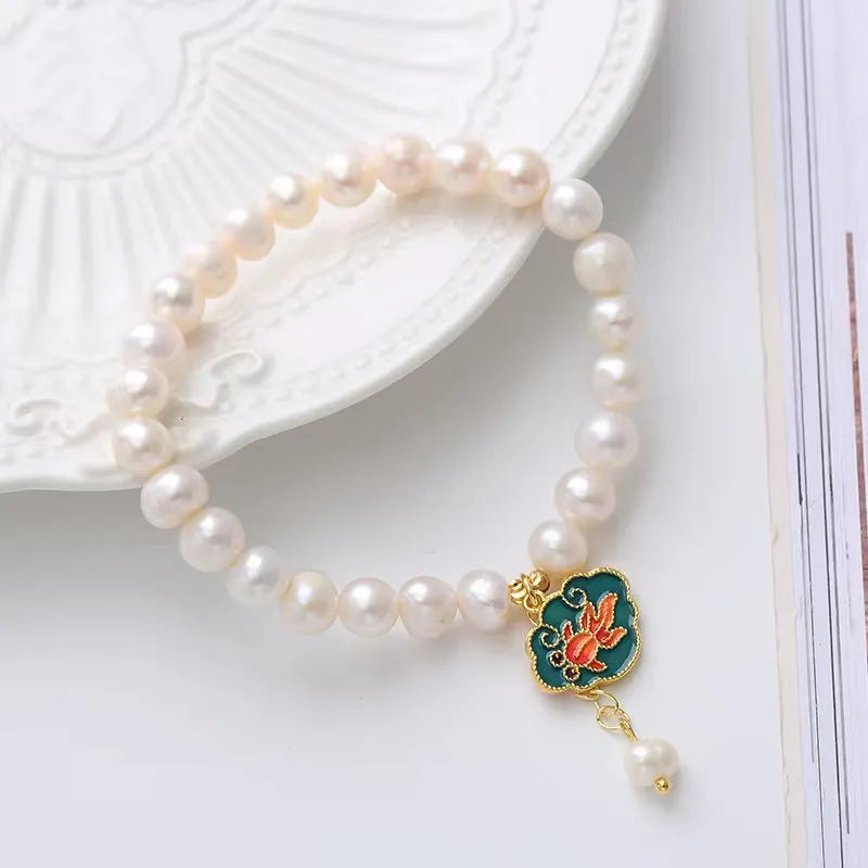White freshwater pearl bracelet with lotus goldfish pendant in antique baroque style