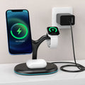 Black three-in-one magnetic wireless charging pad on a table.