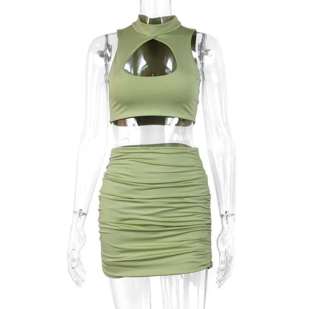 Light purple women's two-piece set with hollow vest and split hip skirt