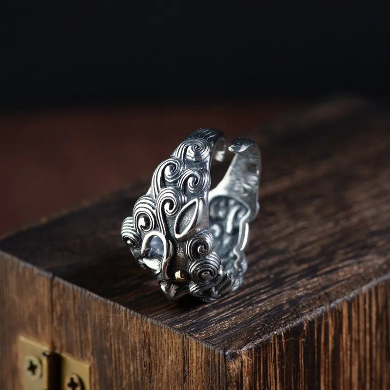 Silver open ring with domineering Jibeast animal Zodiac pattern and diamond detail.