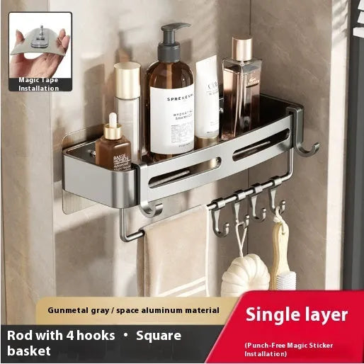 Gun grey metal triangle corner shelf mounted on a bathroom wall for shower storage.