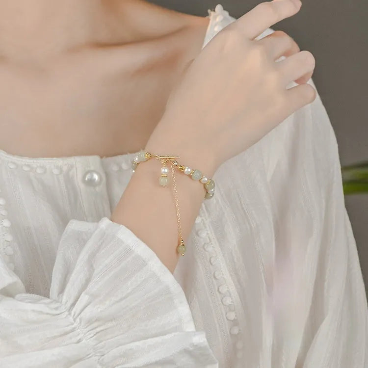 Women's Hetian jade bracelet with round pearl pendant and gold electroplated metal links