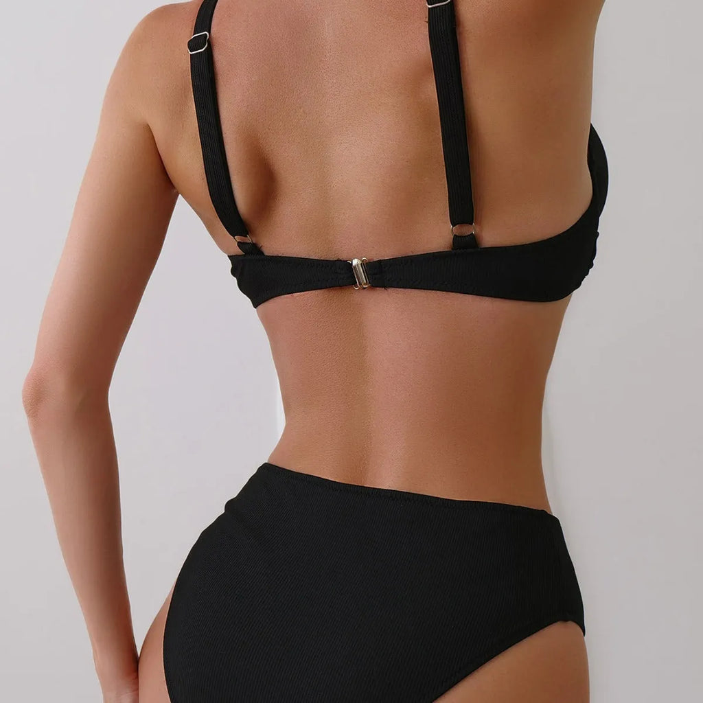Women's solid colour bikini set in polyester rib fabric, shown on a hanger.