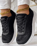 Women's white canvas casual sports running shoes with a flat heel and round toe on a plain background.