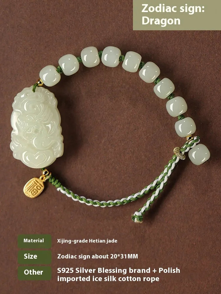 Hetian jade rabbit charm bracelet with sterling silver card on a white ice cotton rope.
