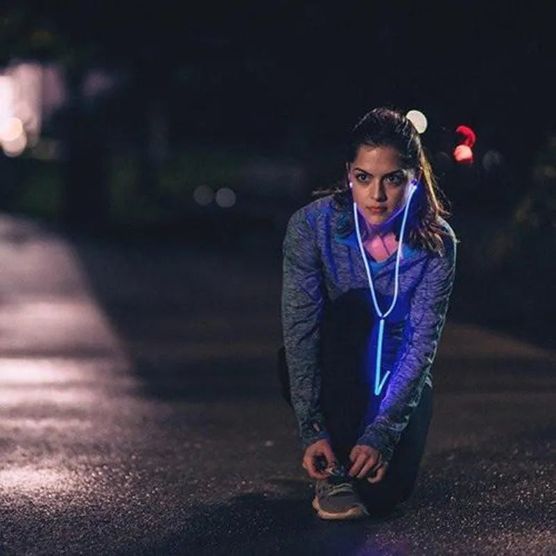 Blue LED light-up earphones with aluminium alloy shells showing rhythm-sync lighting patterns