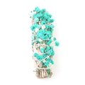 White sage and red rose petal colourful aromatherapy incense bundle on a wooden table