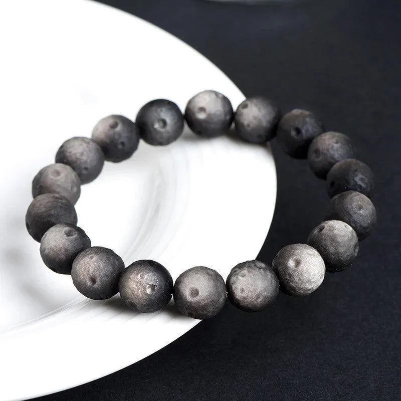 Natural obsidian meteorite crater ball bracelet with polished volcanic glass beads in silver or gold colours