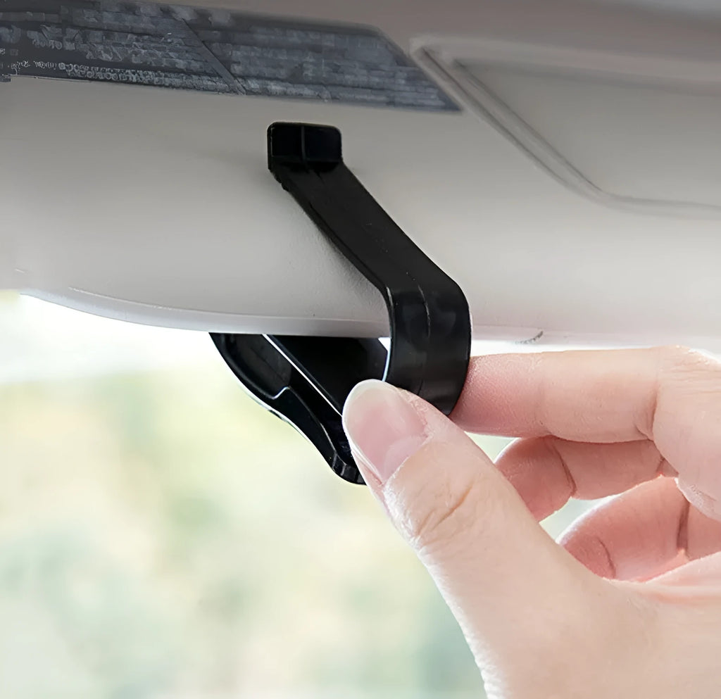 Black plastic clip for mounting glasses and cards on a car sun visor
