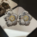 Retro textured gardenia stud earrings with two-tone electroplated finish on copper