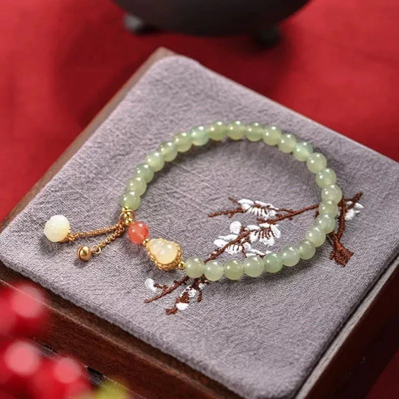 Jade women's bracelet with gold plated gourd charm and fu character decoration