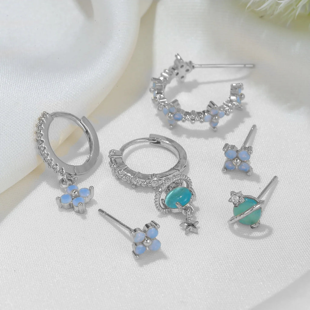 Gold and silver Japanese Korean style flower ear studs with zircon mosaic detail.