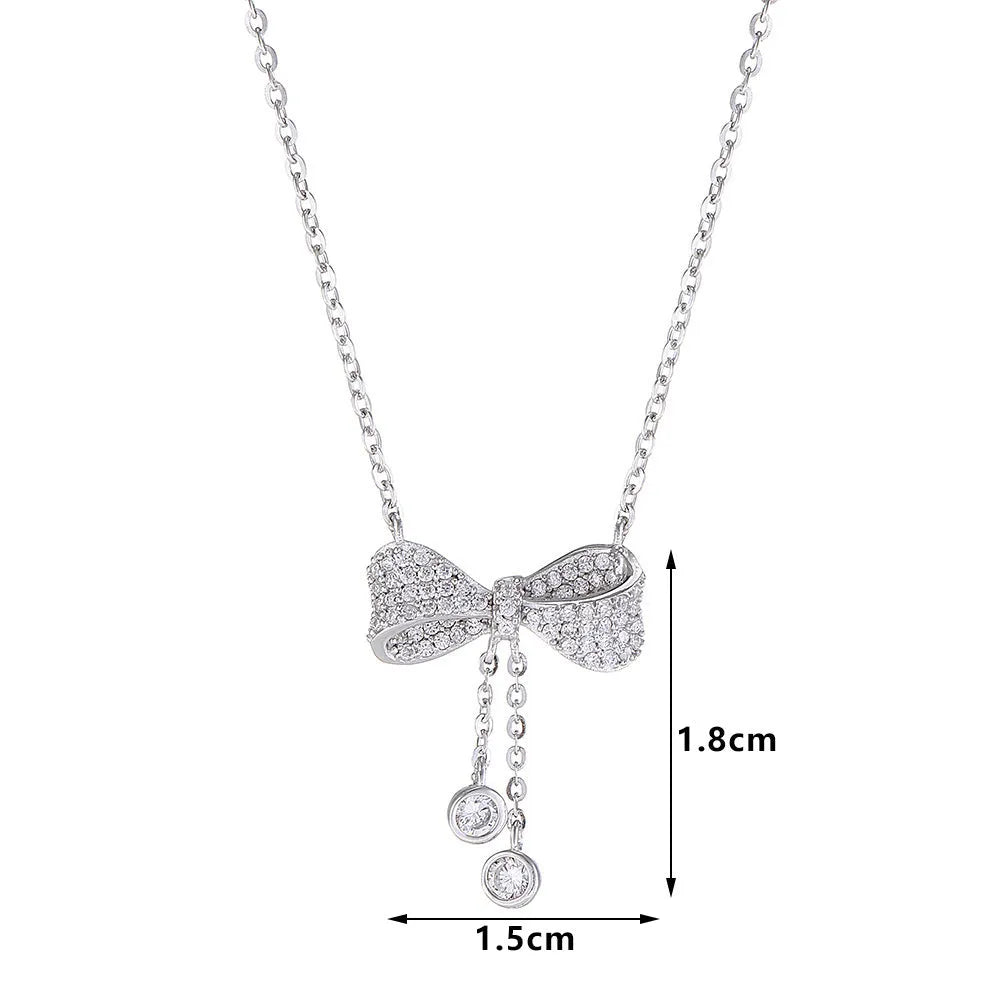 S925 sterling silver necklace with a bow pendant on an O-ring chain.