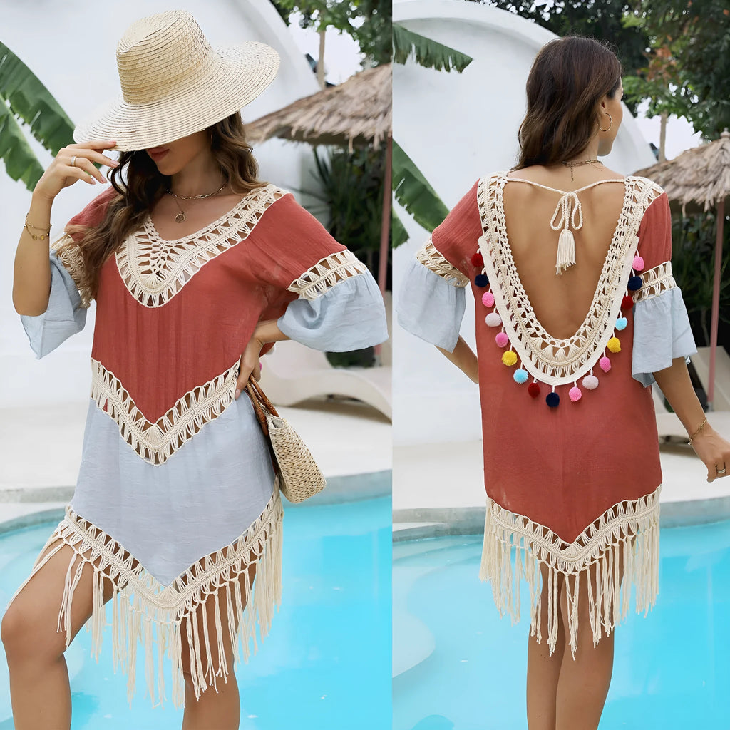 Orange hand-crochet beach overskirt with floral pattern and tassels, part of a matching set