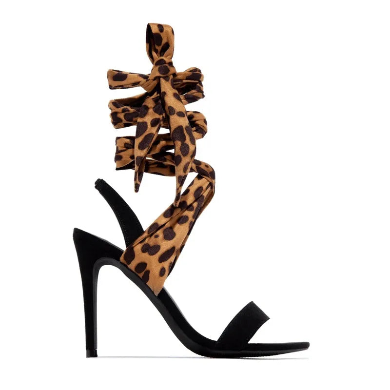 Light brown leopard print women's high heels with Roman cross straps and a thin high heel.