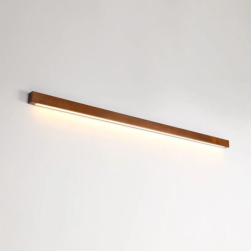 Walnut coloured Log Strip Wall Lamp linear LED light fixture in wood and acrylic